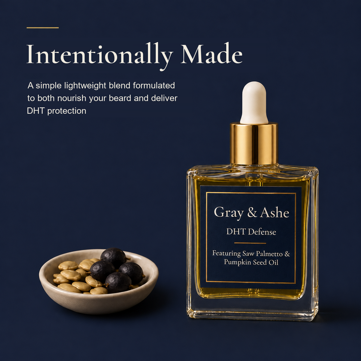 Gray & Ashe DHT Defense beard oil in a square clear glass bottle with a gold collar and white dropper top, shown on a dark navy background beside a small bowl of seeds and berries. Text on the left reads 'Intentionally Made' with product description.